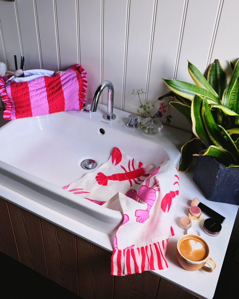 Lobster tea towel on bathroom sink by Amuse La Bouche