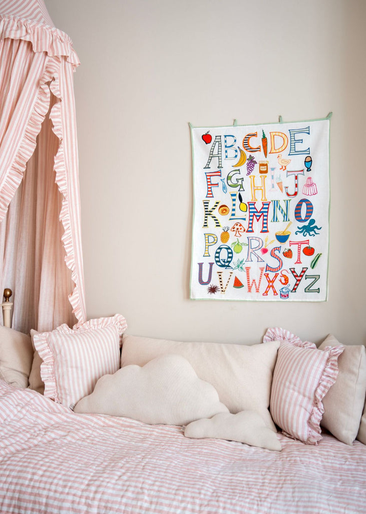 Wall Hanging Using Alphabet Rocks Alphabet wall hanging framed in child's bedroom