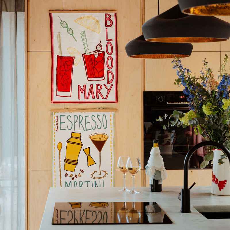 Drinks inspired tea towels hung in a kitchen by Amuse La Bouche